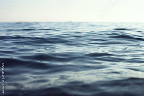 waves on the water surface, soft natural photo background, silence and relaxation concept