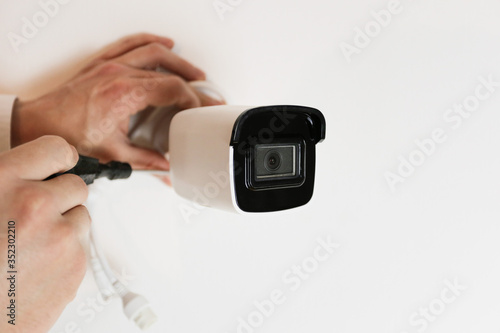 Installation of CCTV camera for home security. Videcam, smart home technology
