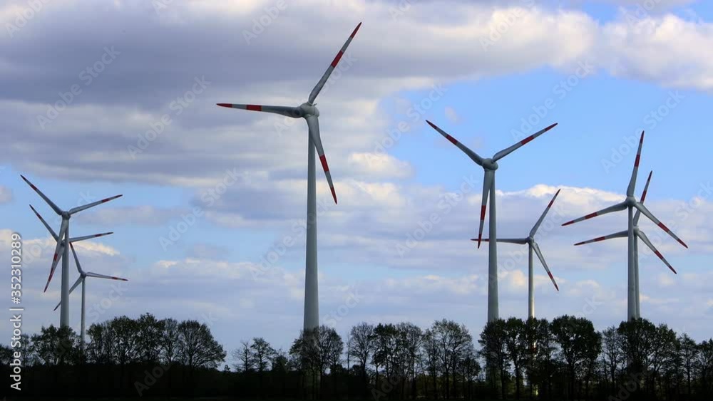 wind turbines and clouds and trees
wind turbines and clouds and trees