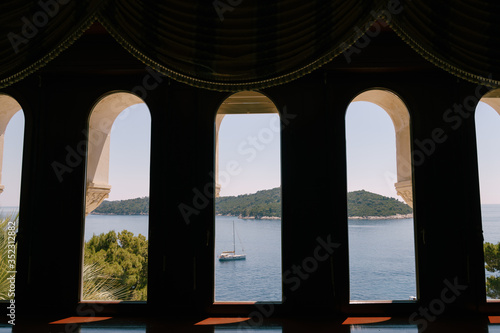 Lokrum is a small island in the Adriatic Sea, near Dubrovnik, Croatia. The view from the window of an old hotel on the nearby ships, yachts and boats.
