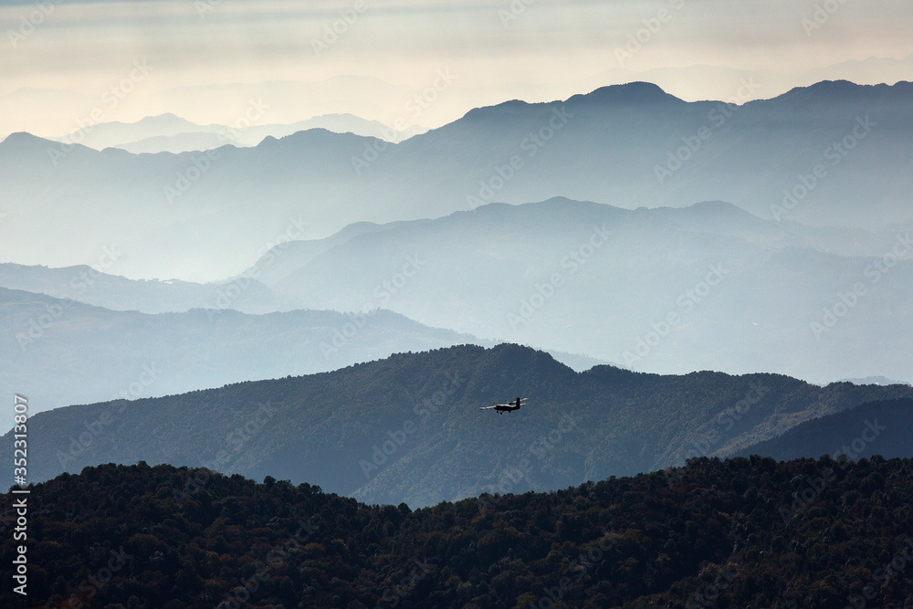 Small airplan over Himalaya Mountains, Nepal.