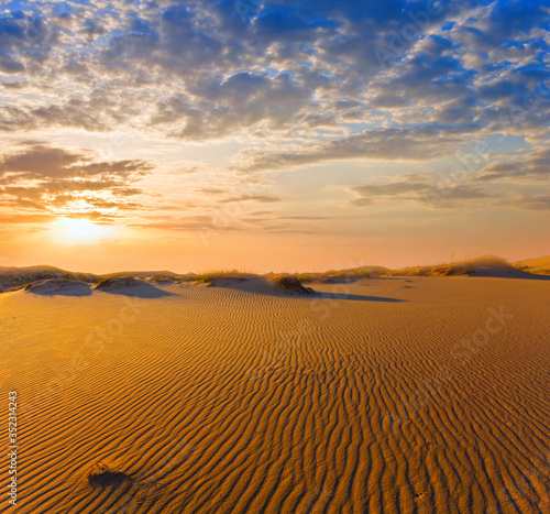 dramatic sunset over a hot sandy desert