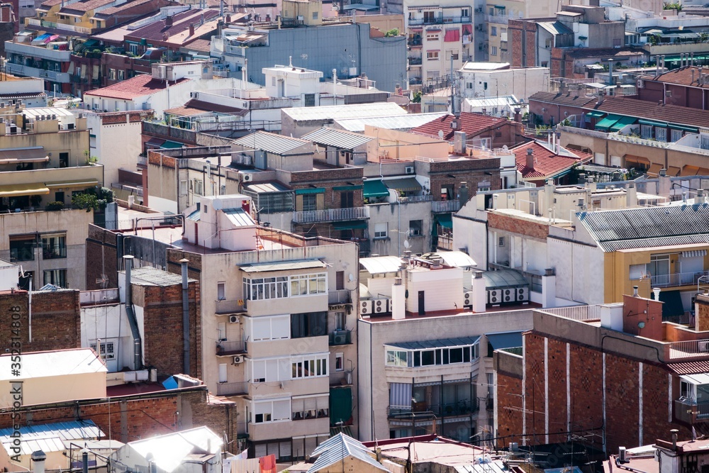 Fototapeta premium close up shots of various colourful houses roofs of Barcelona in a beautiful sunny day from high point of view
