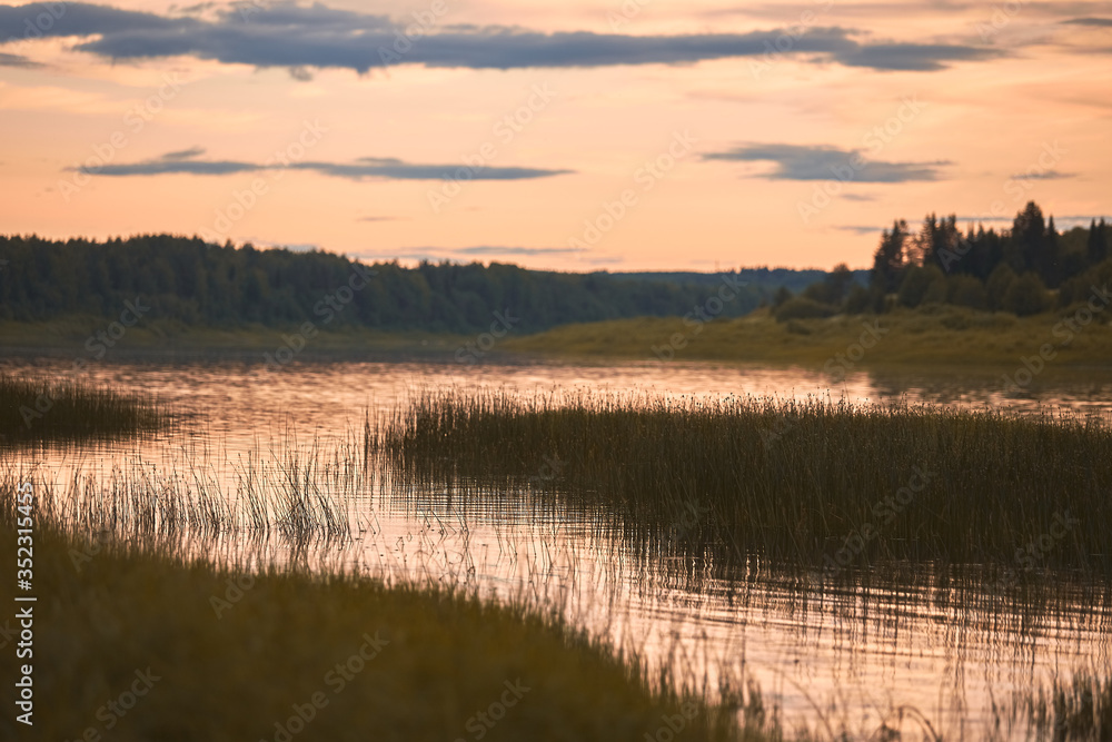 small rural river at sunset in the evening