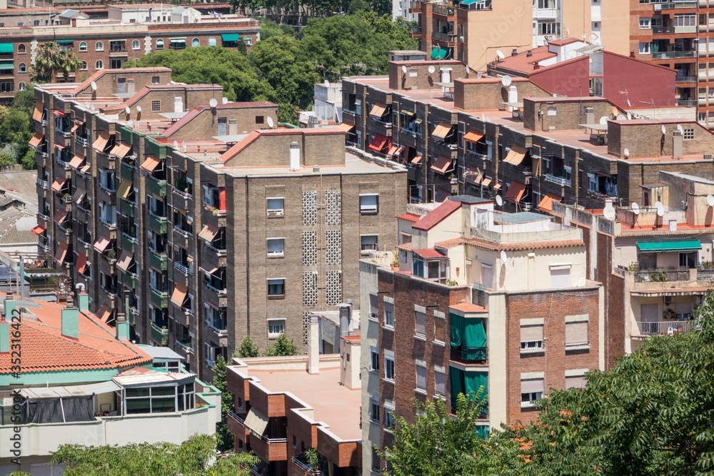 Fototapeta premium close up shots of various colourful houses roofs of Barcelona in a beautiful sunny day from high point of view