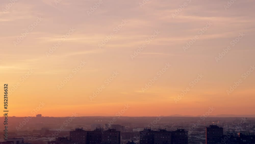 Enjoying sunset and sports at park with Madrid, Spain skyline in the background Enjoying sunset and sports at park with Madrid, Spain skyline in the background