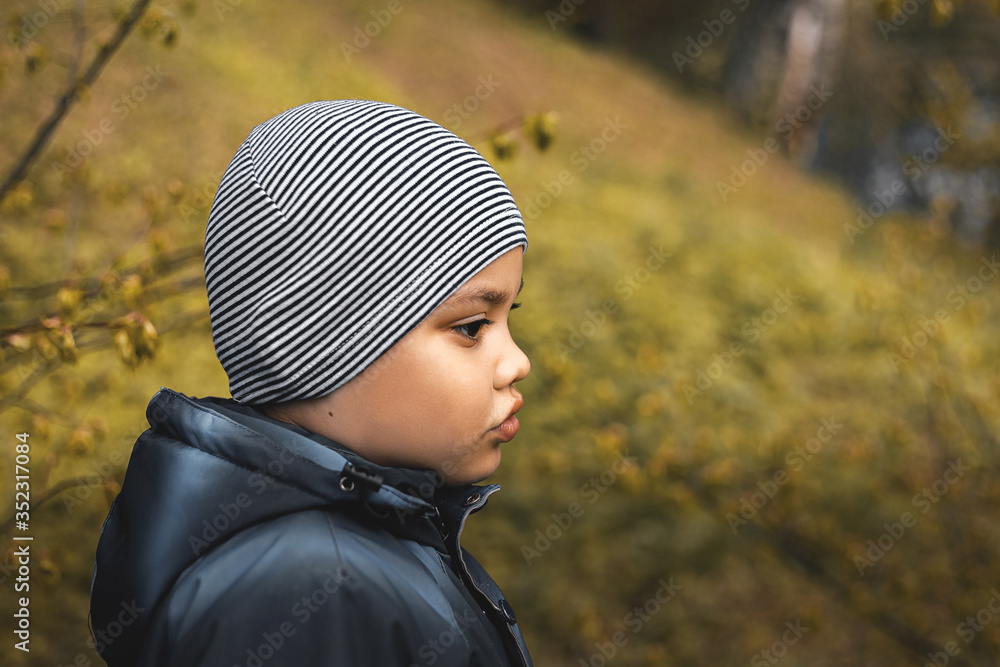 little boy thought about the meaning of life, looking at nature