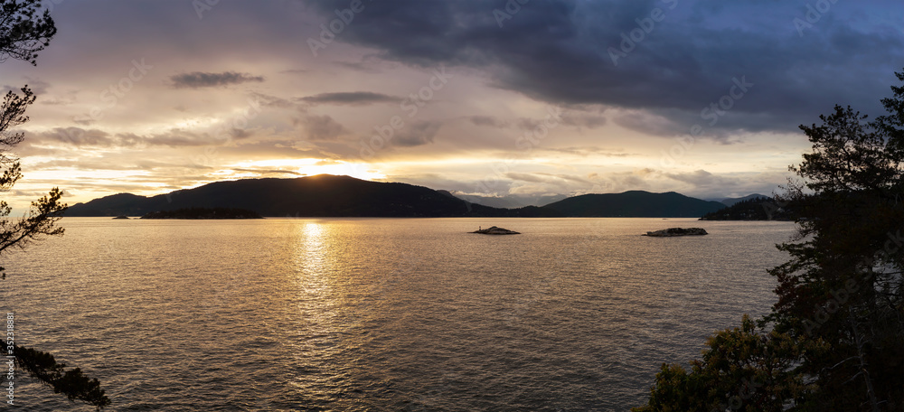 Beautiful Panoramic View of Howe Sound and Bowen Island during a colorful sunset. Taken from Lighthouse Park, West Vancouver, British Columbia, Canada.