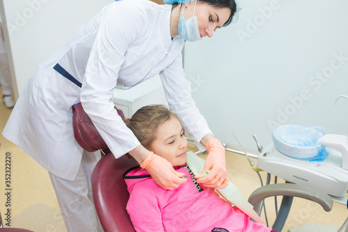 Little girl in dentist clinic. Health care  medicine concept