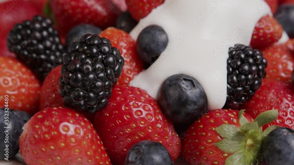 ripe summer berries strawberries, blackberries, blueberries are poured with yogurt ripe summer berries strawberries, blackberries, blueberries are poured with yogurt
