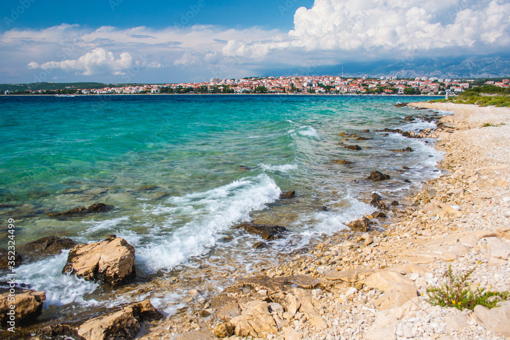 Picturesque coastal view of Novalja town and pebble beach on Pag island in Croatia