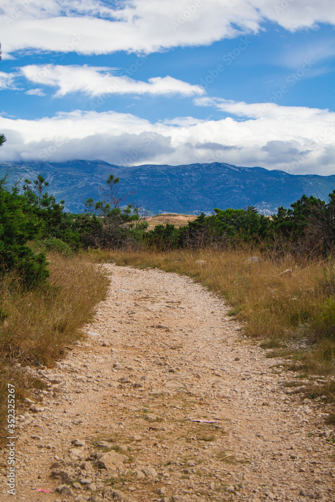 Wild landscape and walkway around Novalja on Pag island in Croatia
