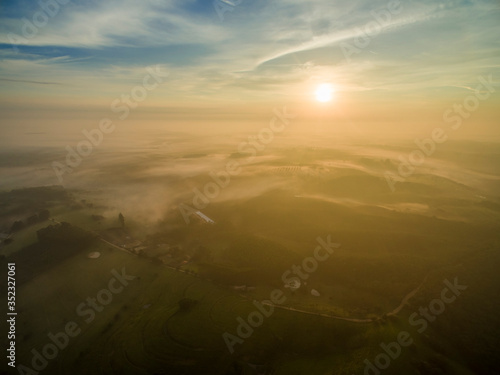 Warm Sunrise over the Clouds at Contryside. photo