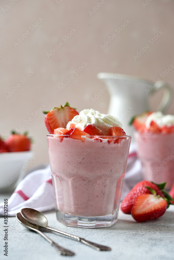 Strawberry mousse with whipped cream and fresh berries in a glasses. Strawberry mousse with whipped cream and fresh berries in a glasses.