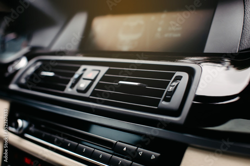 Car air conditioning hole close up. Car dashboard. © kucheruk