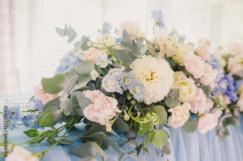 banquet table is decorated with plates, cutlery, glasses, candles and flower arrangements #352328453