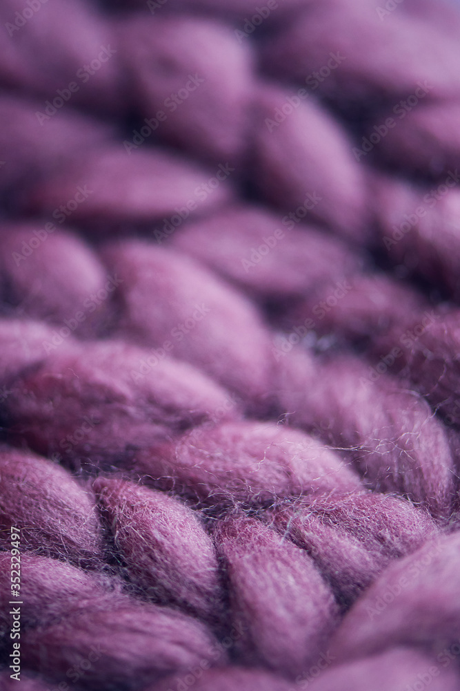 Handmade knitted large blanket, super chunky yarn, trendy concept. Purple color Handmade knitted large blanket, super chunky yarn, trendy concept. Purple color