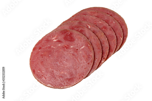 Sliced sausage slices lie on a white background. Isolated.