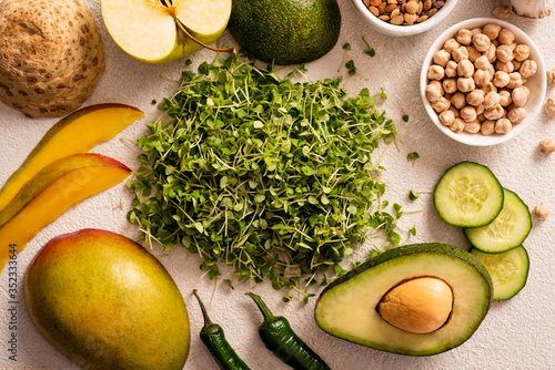 Microgreens, healthy foods for vegetarians. Vegetables and fruits, vegan greens. Top view.