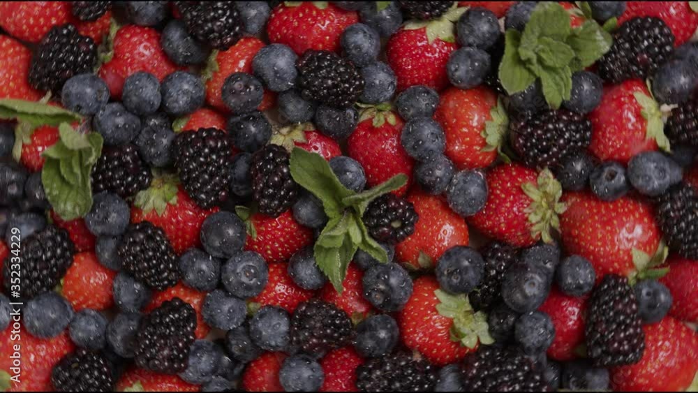 fresh ripe summer berries strawberries, blackberries, blueberries and mint rotate fresh ripe summer berries strawberries, blackberries, blueberries and mint rotate