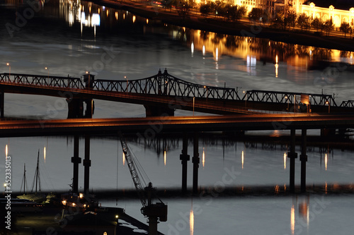 Car and train bridges over the river. © oleksandr