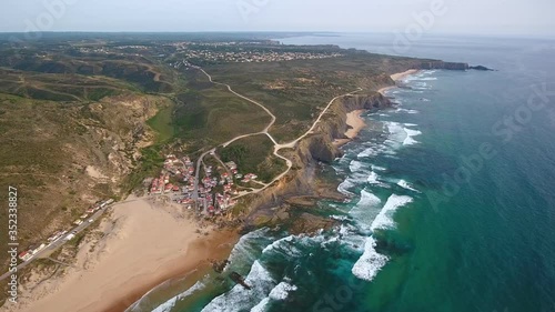 Aerial video shooting. Monte Clerigo surf beach on the Atlantic coast. Portugal, Aljezur, Sagres, Algarve.