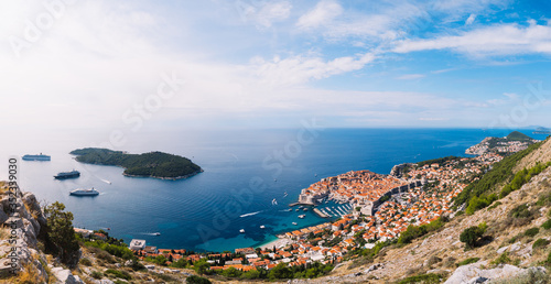 Fototapeta Naklejka Na Ścianę i Meble -  Aerial top view on the old city of Dubrovnik, from the observation deck on the mountain above the city. Film location. The view of the city is based on the Royal Harbor.