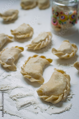 Traditional polish dumplings (called pierogi ruskie) filled with potatoes and cottage cheese. 