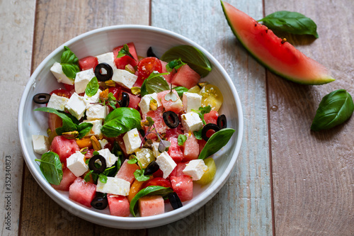 Fotomurale Summer salad with watermelon, tomatoes, feta cheese and basil