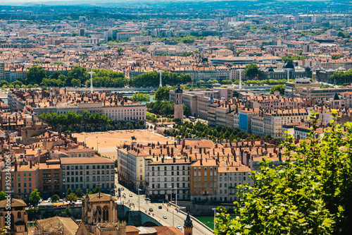 Lyon panorama elevated view on sunny day. Aerial panoramic view of Lyon with the skyline. Bellecour Square And Place Poncet, Lyon, France