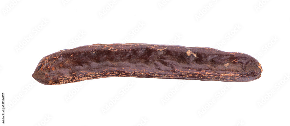 Ripe carob pods and bean isolated on white background. Ripe carob pods and bean isolated on white background.