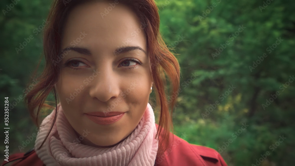 Beautiful smiling young woman portrait in green spring park close up. Pretty female face. Beautiful smiling young woman portrait in green spring park close up. Pretty female face.