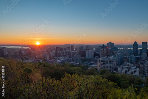 Beautiful sunset over Montreal's skyline viewed from the Kondiaronk belvedere in the Mont-Royal park