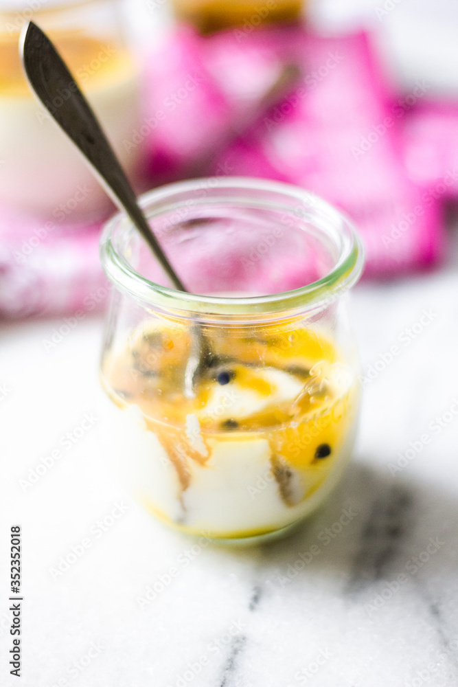 passion fruit panna cotta on tiny glasses and pink napkin passion fruit panna cotta on tiny glasses and pink napkin