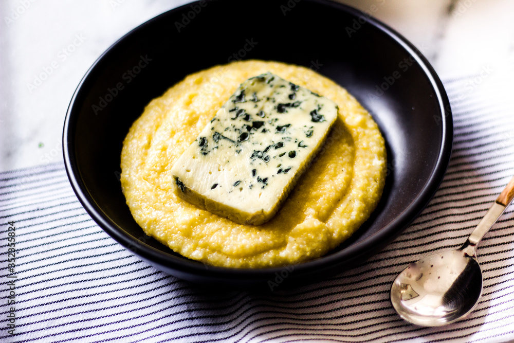 Polenta with blue cheese and black ceramic Polenta with blue cheese and black ceramic