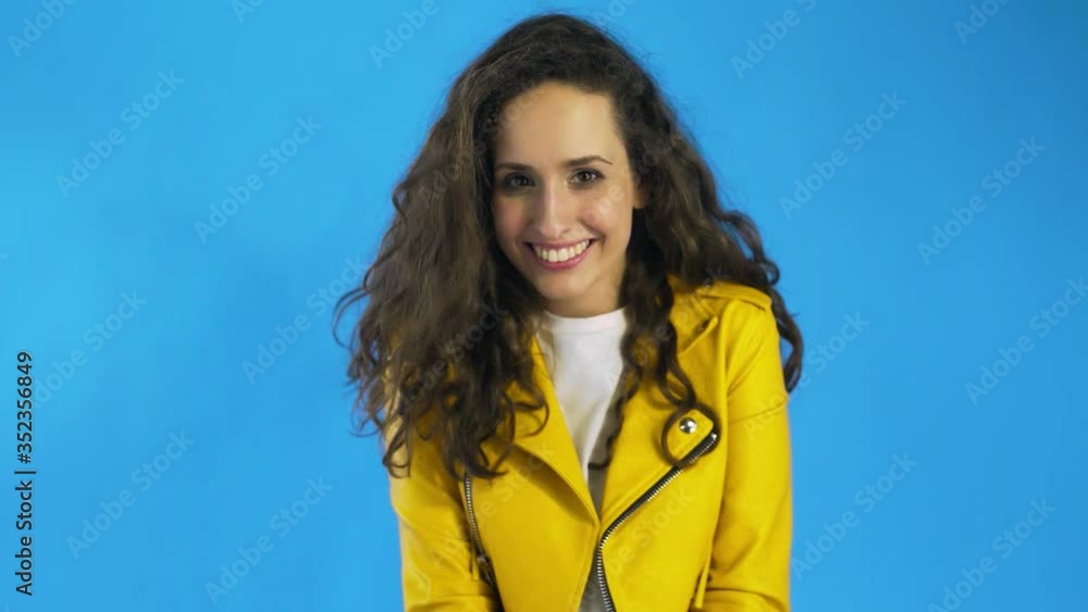 Beautyful woman is looking at camera, wink, flirting and smiling. Beautyful woman is looking at camera, wink, flirting and smiling.