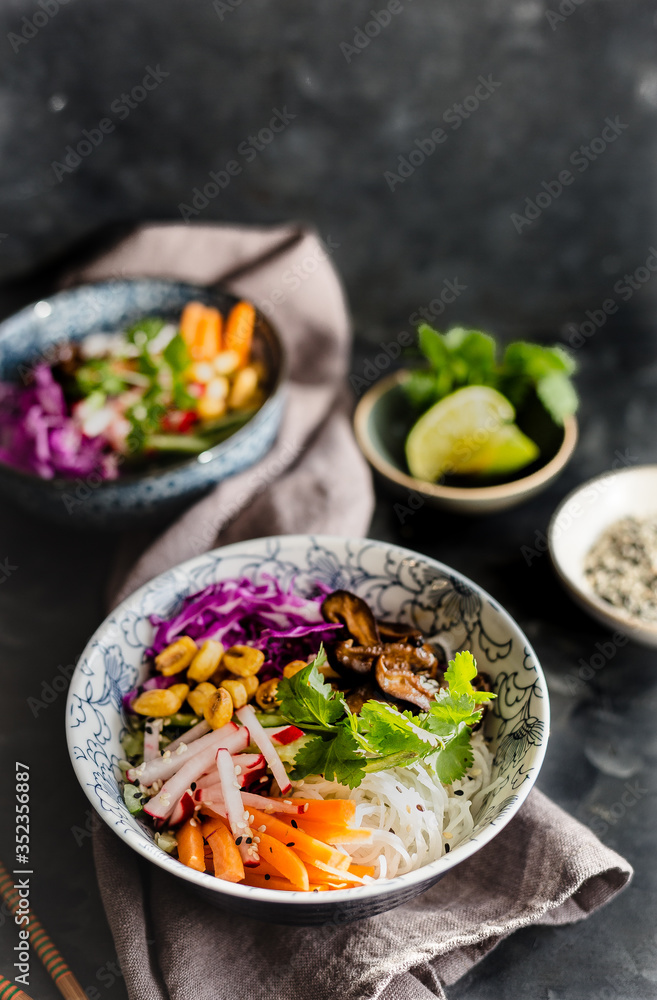 Homemade rice noodles salad with radish, carrot, red cabbage cilantro Homemade rice noodles salad with radish, carrot, red cabbage cilantro