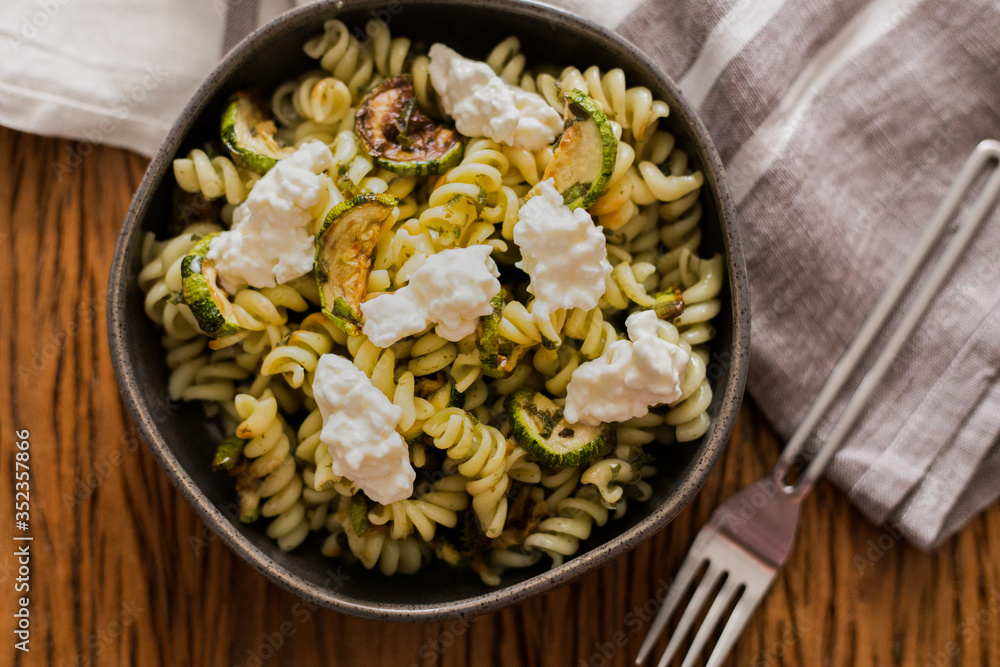 Pasta salad with zucchini and pesto dressing and white cheese Pasta salad with zucchini and pesto dressing and white cheese