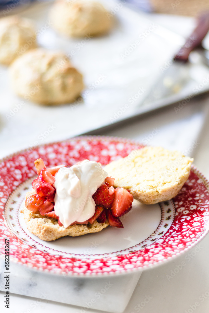 strawberry shortcake with cream on a cute plate