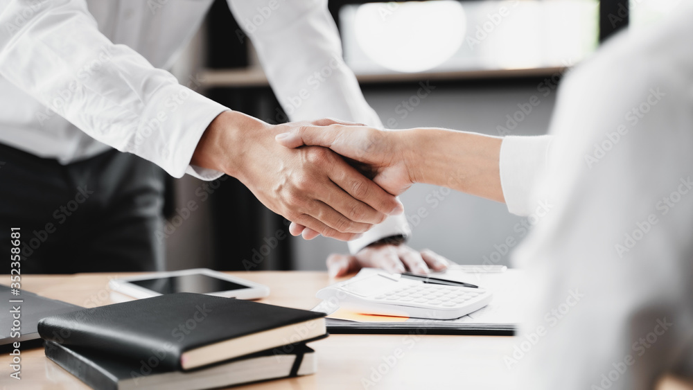 Business start up marketing team hands shaking in co working office. Business start up marketing team hands shaking in co working office.