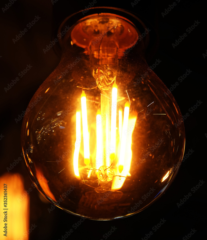 Ceiling lamps on dark background in store