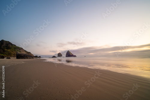 Landscape of rocks and the Pacific coast at sunset. Beautiful picture and night scenery of nature.