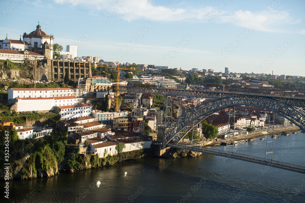 View of the Dom Luis I Bridge over the Douro river and the Bank of Vila Nova de Gaia, Porto, Portugal. .
