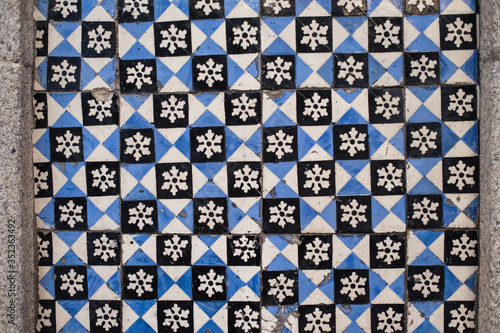 Traditional old tiles on the street walls in Porto, Portugal. Azulejos ceramic tilework.
