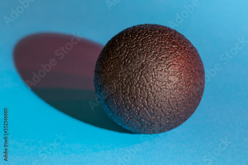 black ball on a blue background