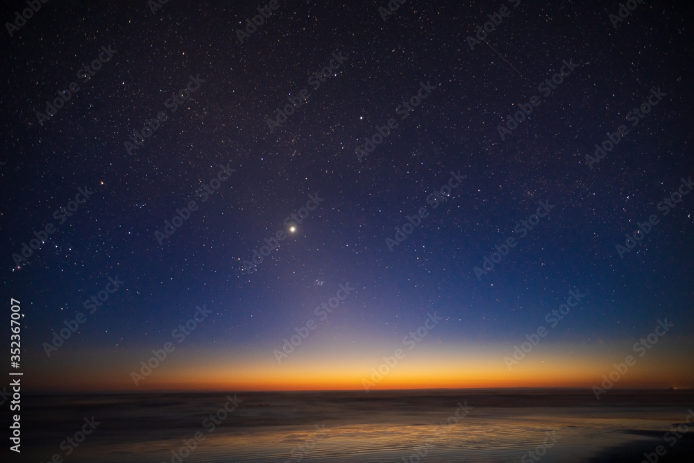 Starry sky, planet Venus, sunset landscape of the Pacific Ocean Starry sky, planet Venus, sunset landscape of the Pacific Ocean