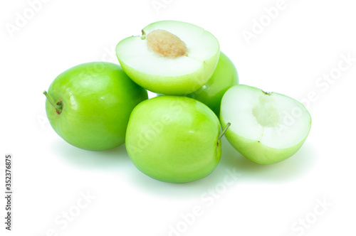 Fresh green jujube fruits, Delicious Chinese jujube fruits with slice isolated on white background. The file includes a clipping path easy to use. Close-up.