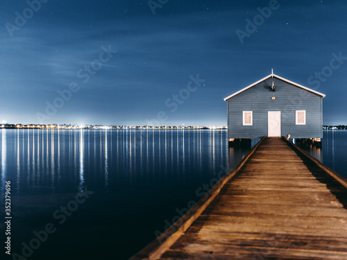 blue boat house in the river 