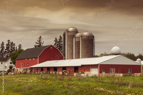 Barn and Silos under an Cloudy Afternoon Sky