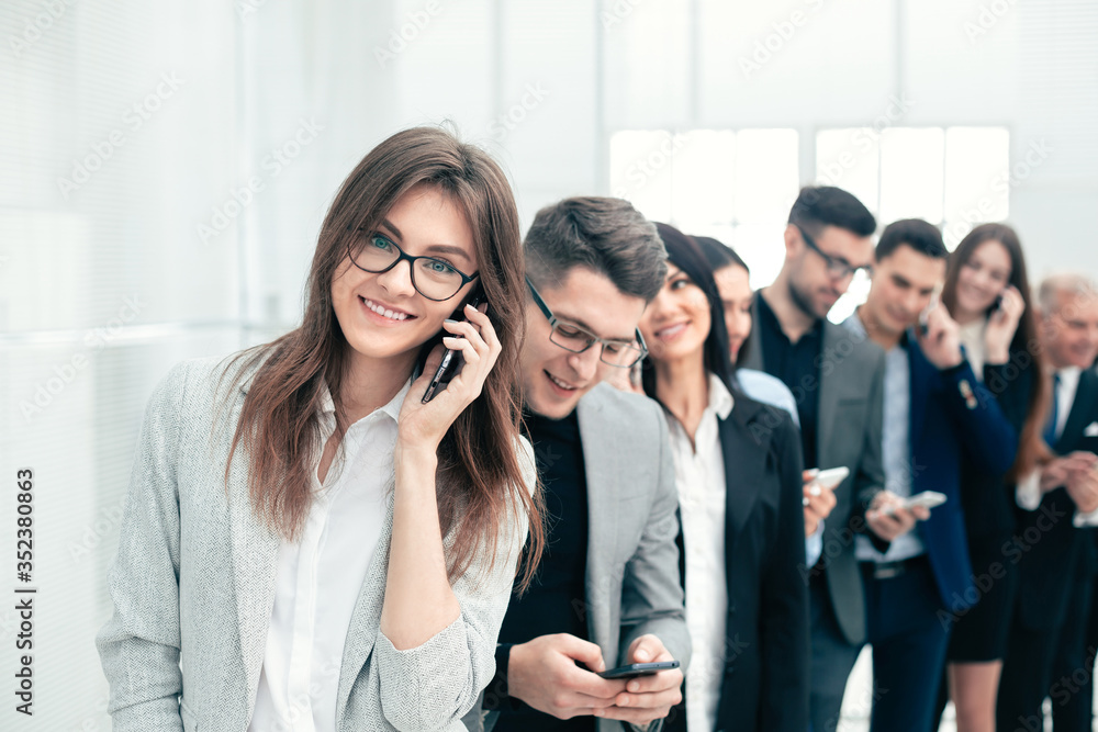 group of diverse young people use their smartphones group of diverse young people use their smartphones